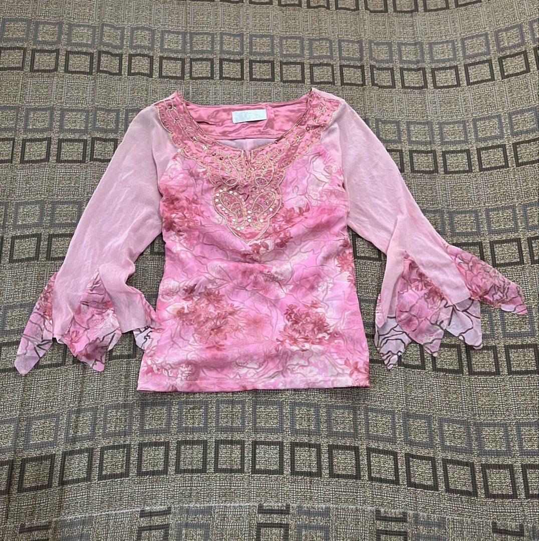Pink Floral Beaded Bell Sleeve Top (Category: Blouses) located in Davao. Submitted by rel18 (Listing ID 1454045280, Image 1). Description: - Pretty pink top with a charming floral print. - Features delicate sheer bell sleeves. - Intricate beadwork and sequins adorn the neckline. - Ideal for parties or a stylish night out. - A truly unique and eye-catching design..
