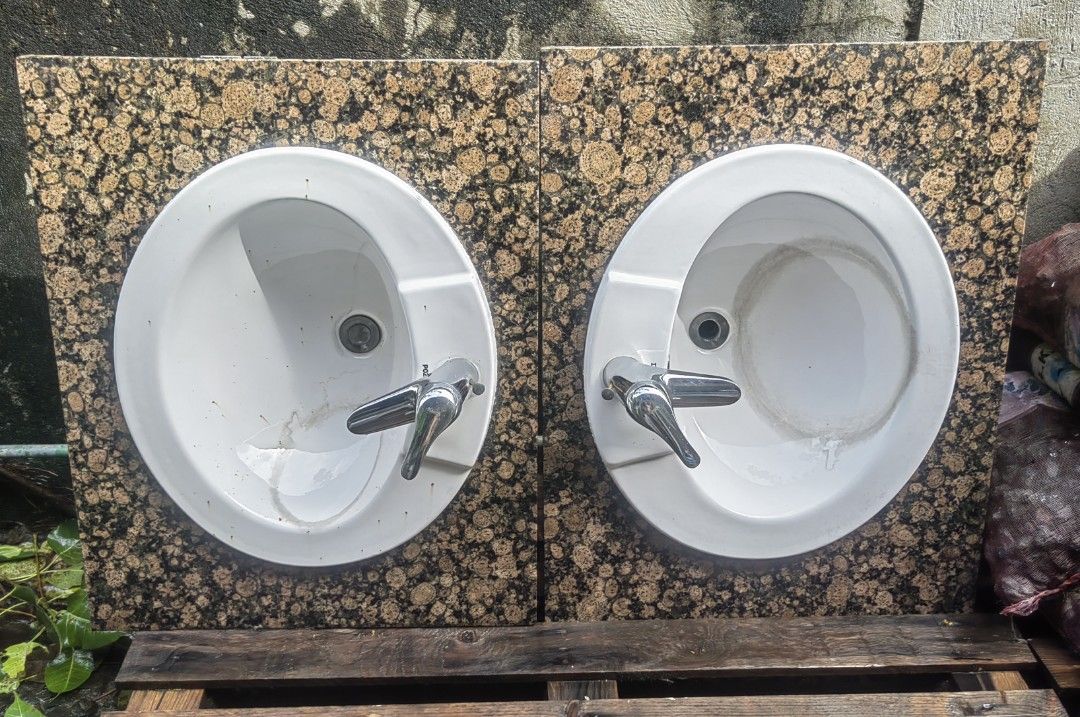 POZZI & MÄSCH White Ceramic Sinks with Granite Backsplash (Category: Bathroom & Kitchen Fixtures) located in Makati City. Submitted by donald1983 (Listing ID 1454006781, Image 1). Description: -1500 each pick up: makati - Set of 2 white ceramic sinks - Granite backsplashes with speckled brown and gold pattern - Faucets included - One sink has interior staining - Ideal for renovation projects or unique bathroom designs .