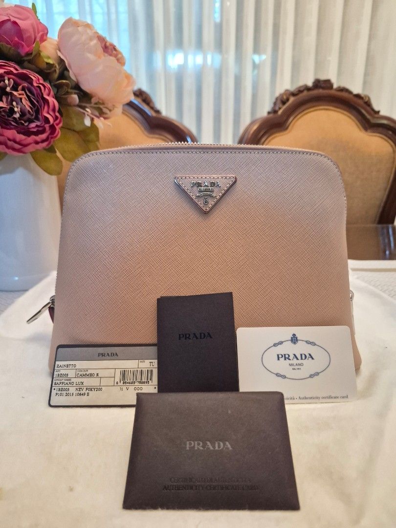 Prada Saffiano Backpack (Category: Luxury Bags & Wallets) located in Quezon City. Submitted by _jewelqueyquep (Listing ID 1454098326, Image 1). Description: Pre-loved, authentic Prada Saffiano Backpack in blush or muted pink color. Used once in a US trip. Feels new, looks new. No issues, in pristine condition.❤️ with dust bag and all cards. Location: Quezon City.