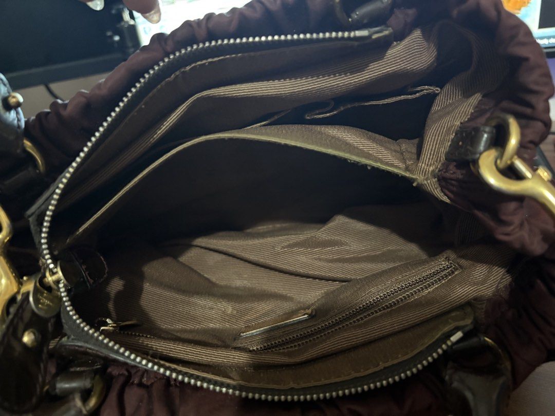 Preloved Ferragamo Bag (Category: Luxury Bags & Wallets) located in Manila. Submitted by JAngel (Listing ID 1454138917, Image 3). Description: Preloved Nylon type with patent Original With flaws Buy at your own risk No return, No Refund As is where is.