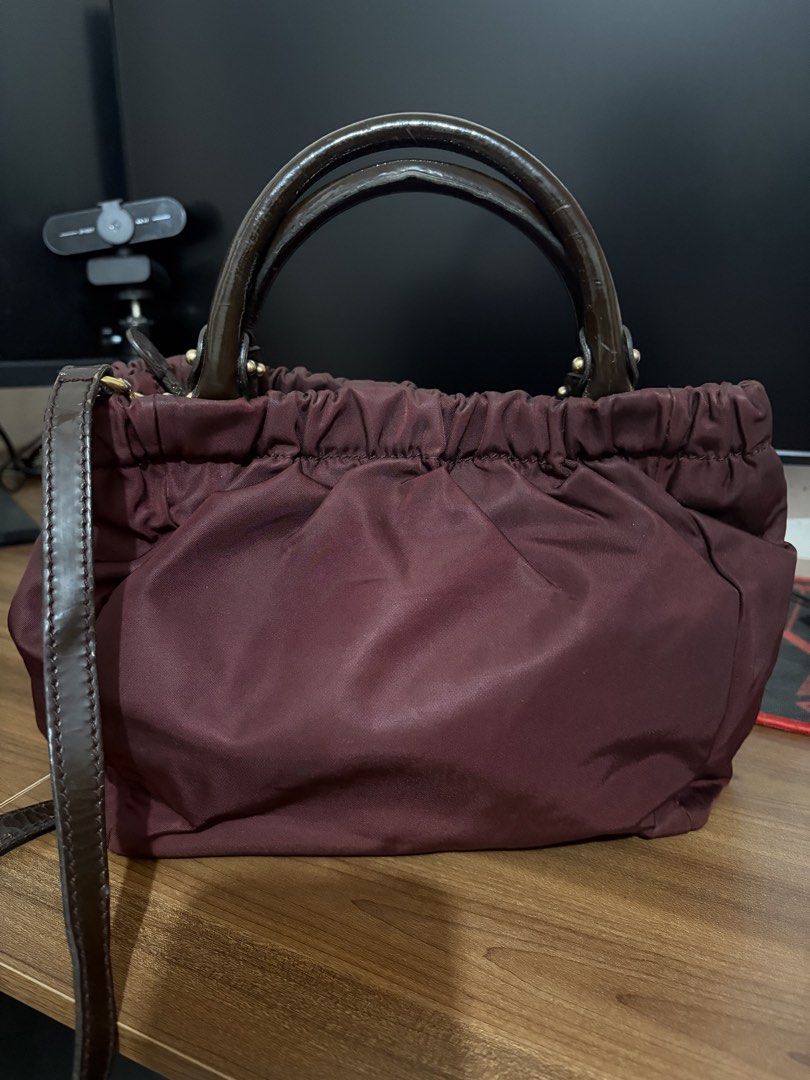 Preloved Ferragamo Bag (Category: Luxury Bags & Wallets) located in Manila. Submitted by JAngel (Listing ID 1454138917, Image 2). Description: Preloved Nylon type with patent Original With flaws Buy at your own risk No return, No Refund As is where is.
