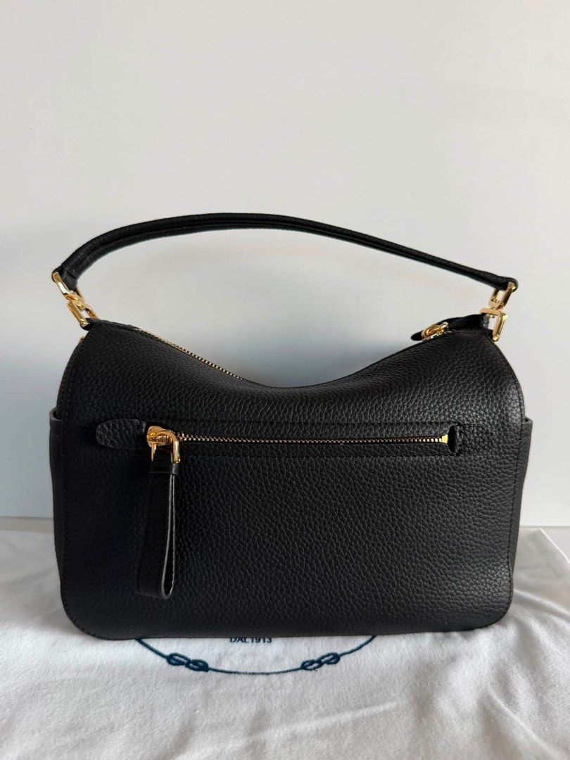 Preloved Prada Leather Handbag (Category: Luxury Bags & Wallets) located in Manila. Submitted by bagsandshoesmanymore (Listing ID 1434187496, Image 2). Description: - Authentic Prada handbag -Size 24cm -RiRi zipper - Top handle and detachable shoulder strap - Gold-tone hardware - Prada-branded interior lining - Interior zippered pocket - Prada logo on fronts Please read before you order 👉🏻❗️Payment first before shipping ❗️Cut off time of paymen