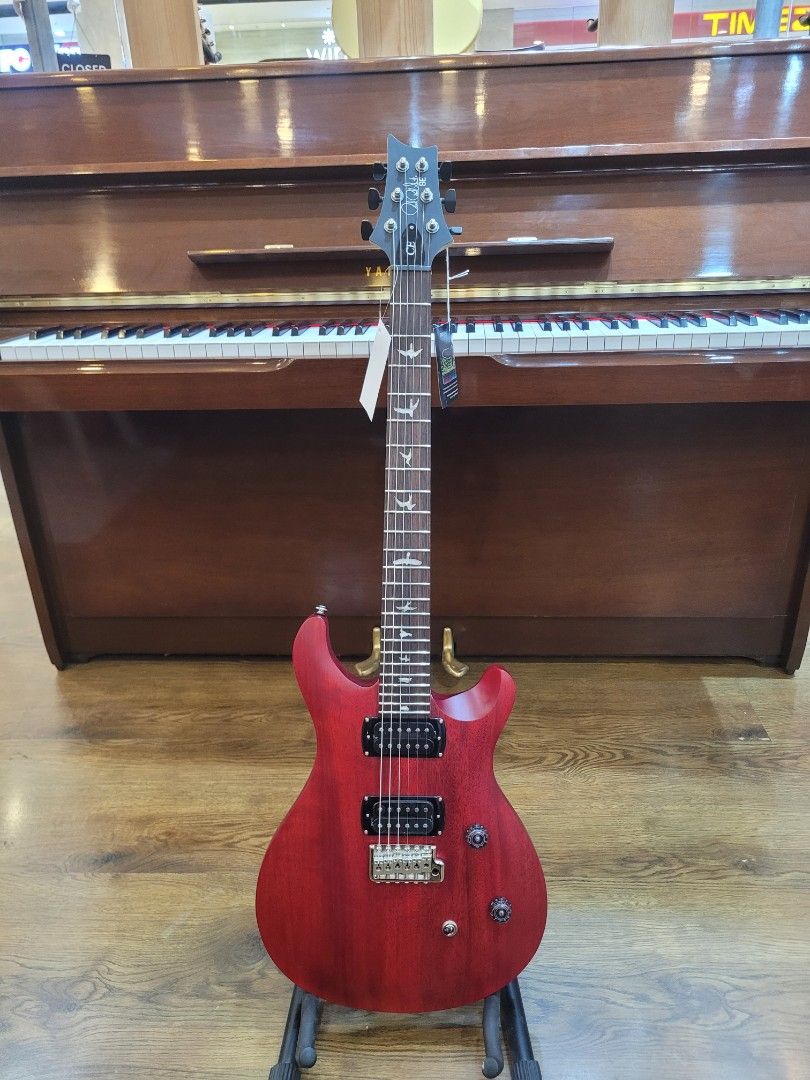 PRS SE Custom 24 Electric Guitar - Red (Category: Musical Instruments) located in Mandaluyong City. Submitted by nathan_012 (Listing ID 1454020739, Image 1). Description: - Vibrant red PRS SE Custom 24 electric guitar - Equipped with two humbucker pickups - Comfortable neck for easy playing - Distinctive bird inlays on the fretboard - Comes with a complimentary guitar stand 📍 Lyric New Glorietta 2, Palm Drive Makati City 📞 (02)7719-7562 TNT 096