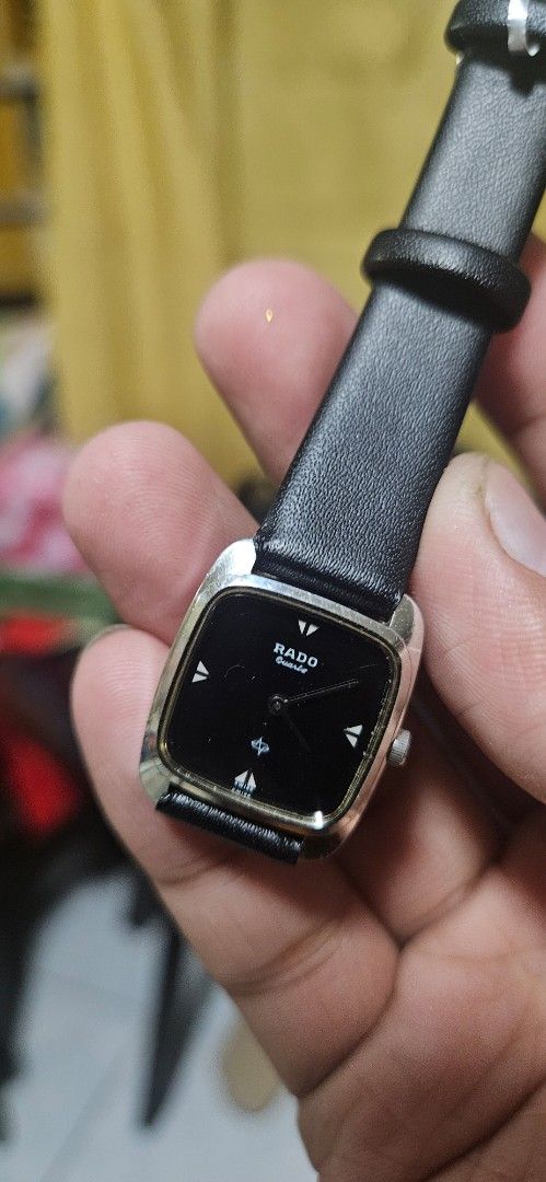 Rado Quartz Watch Black Face Leather Strap (Category: Luxury Watches) located in Santa Maria. Submitted by rommelmateo (Listing ID 1454100224, Image 1). Description: - Vintage Rado watch - Classic black face with silver markers - Square design - Includes black leather strap - Requires a new battery - Minor scratches on the face - Sold as is.