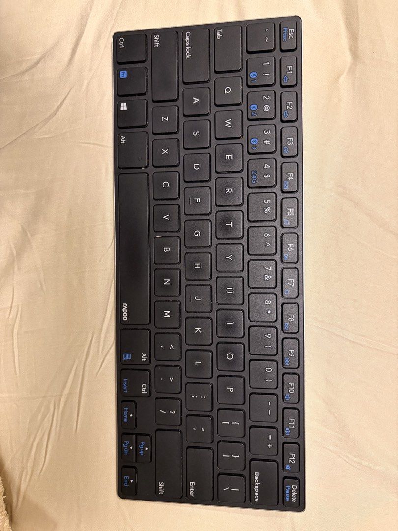 Rapoo Multi-mode Wireless Keyboard (Category: Computer Keyboard) located in Muntinlupa City. Submitted by apcm97 (Listing ID 1454132421, Image 1). Description: - Slim and compact design, perfect for saving desk space. - Versatile connectivity: Connects via Bluetooth or 2.4GHz wireless. - Powered by 2 AAA batteries (not included). - Model: Rapoo E6050M - Ideal for a clutter-free and efficient workspace - Feel free to ask any questions!.