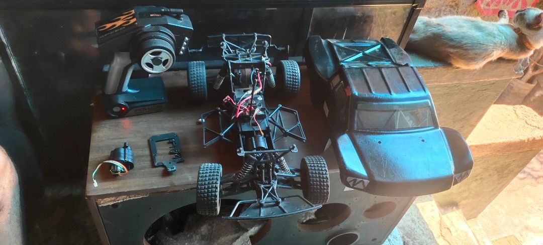 RC Car Chassis with Remote and Body Shell (Category: Remote Control Toys) located in Caloocan City. Submitted by mjraymundo48160 (Listing ID 1454042162, Image 1). Description: - RC car chassis with motor and steering servo - Includes remote control - Separate body shell included - Some parts are detached - Ideal for repair or customization projects - Great for hobbyists -need to change servo.