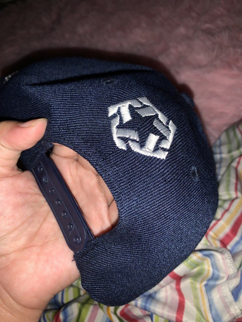Real Fire Original Snapback Cap (Category: Caps & Hats) located in Binan City. Submitted by kariray_shop (Listing ID 1454066745, Image 2). Description: - Brand: Real Fire - Color: Navy Blue - Style: Snapback Cap - Features: Original design with embroidered logo on front and side - Fit: Adjustable strap at the back - Occasion: Casual wear.