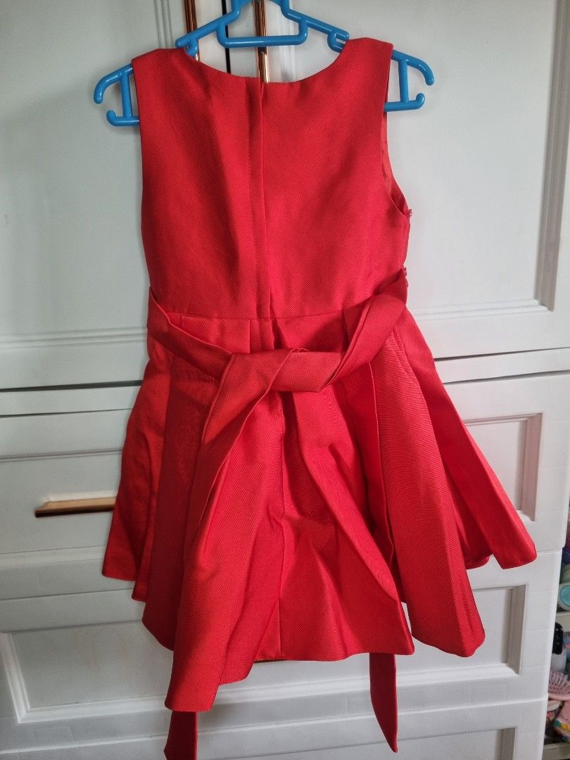 Red Beaded Party Dress with Bow (Category: Dresses) located in Caloocan City. Submitted by lianna_12 (Listing ID 1454114678, Image 2). Description: - Gorgeous red party dress for girls. - Intricate beading and sequins on the bodice. - Adorable large bow on the front. - Lovely pleated skirt design. - Comes with a matching sash. - Ideal for parties and special occasions. - 3T-4T - Used once bought in Sm Department Store.