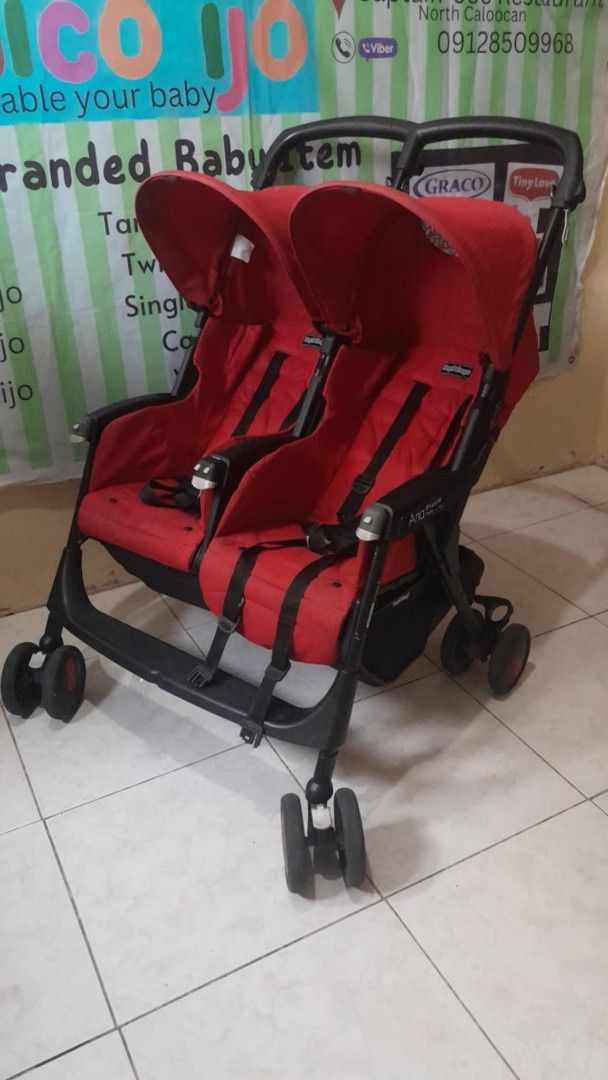 Red Twin Stroller for Two Babies (Category: Strollers) located in Caloocan City. Submitted by Unicoijo02 (Listing ID 1454163858, Image 2). Description: - Red double stroller, ideal for twins or siblings close in age. - Easy to maneuver for smooth rides. - Conveniently folds for compact storage. - Equipped with safety harnesses for secure seating. - Ready for your next adventure!.