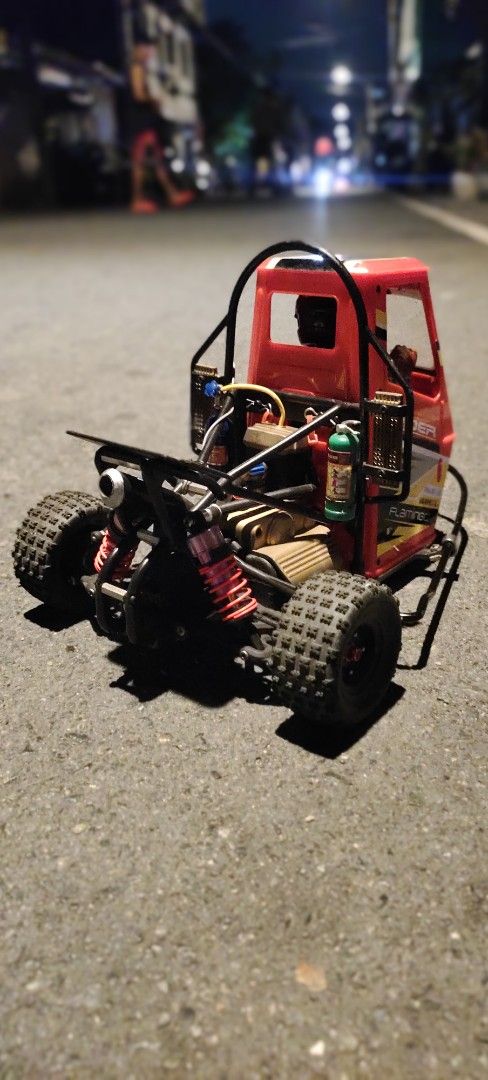 Red Xrider RC Buggy Off-Road Remote Control Car (Category: Remote Control Toys) located in Caloocan City. Submitted by mjraymundo48160 (Listing ID 1454040765, Image 3). Description: - Xrider buggy for sale - Ready to run off-road - Strong frame and suspension - Tires with good grip - Minor scuffs from use - Great for outdoor adventures.