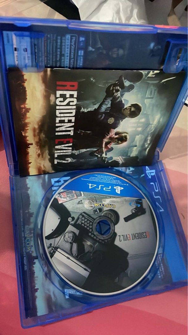 Resident Evil 2 PS4 4 (Category: PlayStation) located in Bulacan. Submitted by fiapple (Listing ID 1454022837, Image 2). Description: - Resident Evil 2 for PlayStation 4 - Includes Limited Edition Deluxe Weapons DLC.