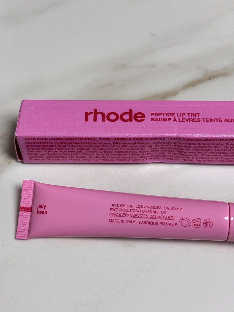 Rhode Peptide Lip Tint in Jelly Bean (Category: Makeup) located in Leyte. Submitted by modernpersephone (Listing ID 1454077855, Image 1). Description: - Rhode Peptide Lip Tint in Jelly Bean shade - Hydrating formula with peptides - Adds a subtle hint of color and moisture - Comes in cute pink packaging - Ideal for everyday wear NOT FAKE!!!.