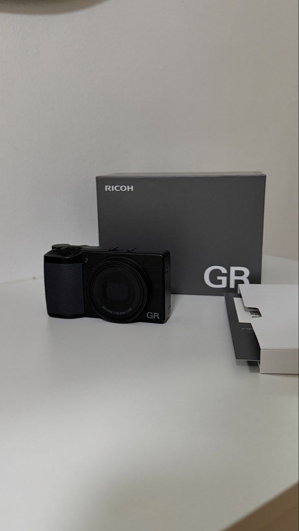 Ricoh GR IV Digital Camera (Category: Cameras) located in Muntinlupa City. Submitted by minimalist_k (Listing ID 1454025593, Image 1). Description: - Ricoh GR IV Camera - Color: Black - Ideal for street photography - Comes with original box and warranty cards - Shutter Count: 8490 - Bought from CameraHaus Aura in January 2026 - Orig Price: 94,000 - Like new condition .