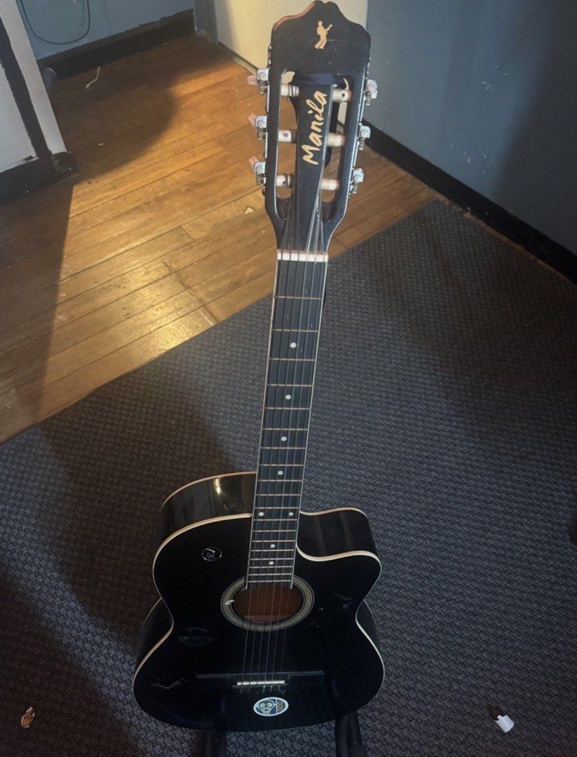 RJ Manila Black Acoustic Guitar (Category: Musical Instruments) located in Manila. Submitted by khloset (Listing ID 1454040554, Image 2). Description: Rfs: Barely used it - Comes with a trusspod - May need to get restringed (ask for string) and wiped - Guitar stand and stickguard included - Not a set price, slightly negotiable - Bought for 7000.