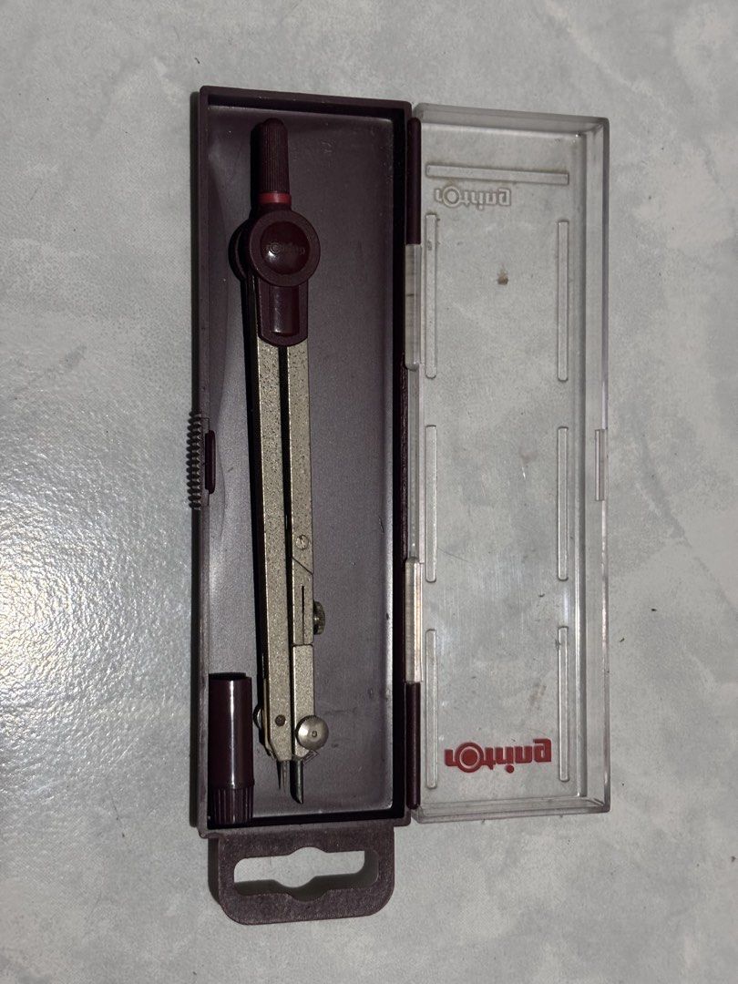 Rotring Compass Set with Case (Category: Stationery & School Supplies) located in Antipolo. Submitted by stephentab38127 (Listing ID 1454125396, Image 2). Description: - Rotring compass in original case - Ideal for drawing circles and arcs - Compass is in good shape, all parts appear to be present - Case shows some scuffs, but is functional - Ready for your next drawing or drafting project.