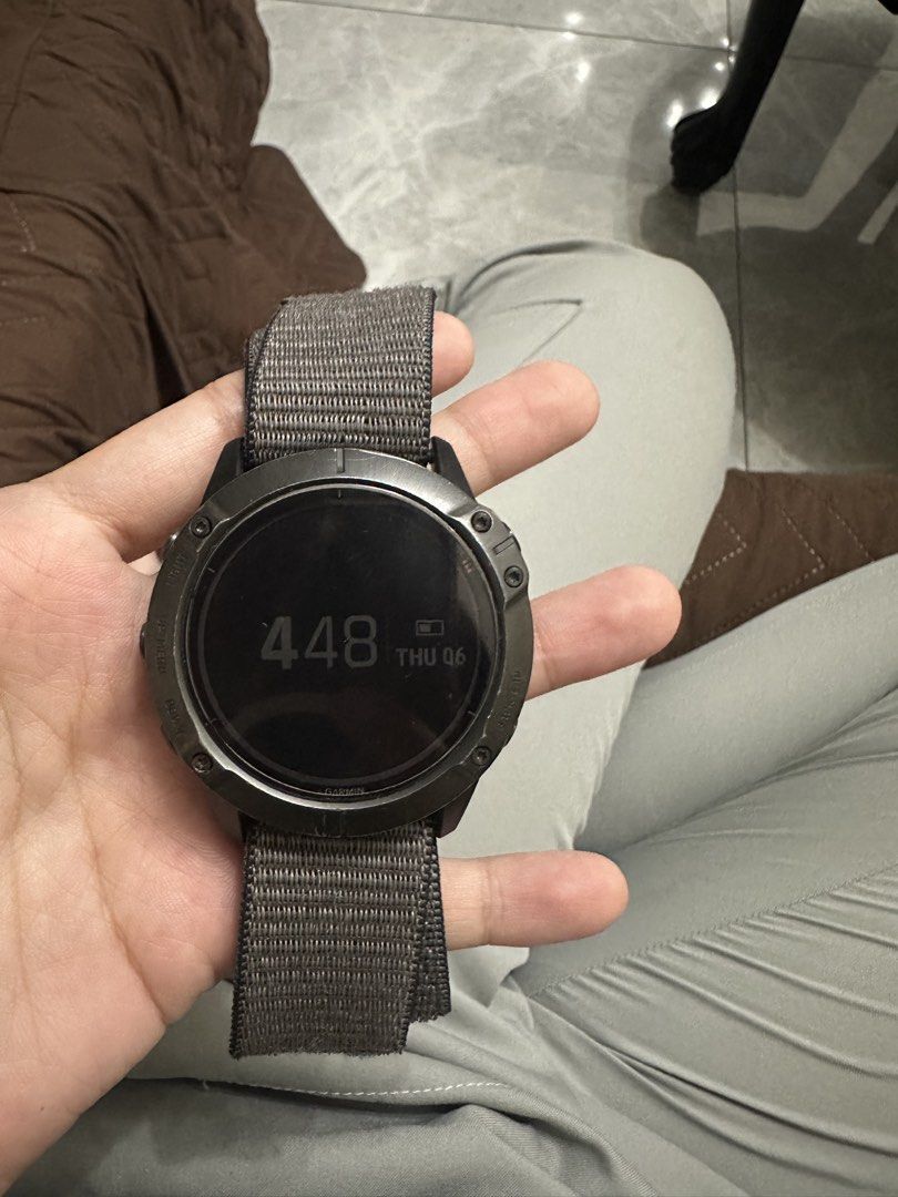 RUSH! Garmin Fenix 6X Pro Solar Titanium Smartwatch (Category: Wearables & Smart Watches) located in San Juan City. Submitted by unclutterermnl (Listing ID 1454090263, Image 2). Description: - Garmin Fenix 6X Pro Solar - Durable Titanium Casing with Power Glass - Water Resistant up to 100 meters - Includes Grey Nylon Strap - Ideal for Outdoor Activities & Everyday Wear - Displays Time and Date -with original box.