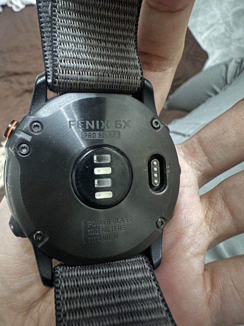 RUSH! Garmin Fenix 6X Pro Solar Titanium Smartwatch (Category: Wearables & Smart Watches) located in San Juan City. Submitted by unclutterermnl (Listing ID 1454090263, Image 3). Description: - Garmin Fenix 6X Pro Solar - Durable Titanium Casing with Power Glass - Water Resistant up to 100 meters - Includes Grey Nylon Strap - Ideal for Outdoor Activities & Everyday Wear - Displays Time and Date -with original box.