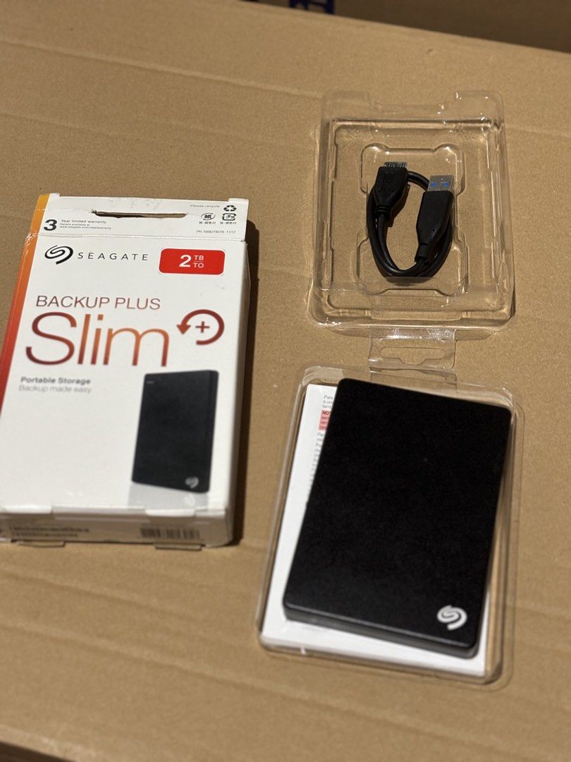 Seagate Backup Plus Slim 2TB External Hard Drive (Category: Hard Disks & Thumbdrives) located in Santa Rosa. Submitted by mikad (Listing ID 1454182481, Image 3). Description: Nabili namin sa orange app. Never been used. Spare item pang incase of emergency lang nung wedding. Doubtful ako sa authenticity kasi ang mura sa orange app. - Seagate Backup Plus Slim Portable External Hard Drive - 2TB Storage Capacity - Includes USB Cable - Ideal for backi