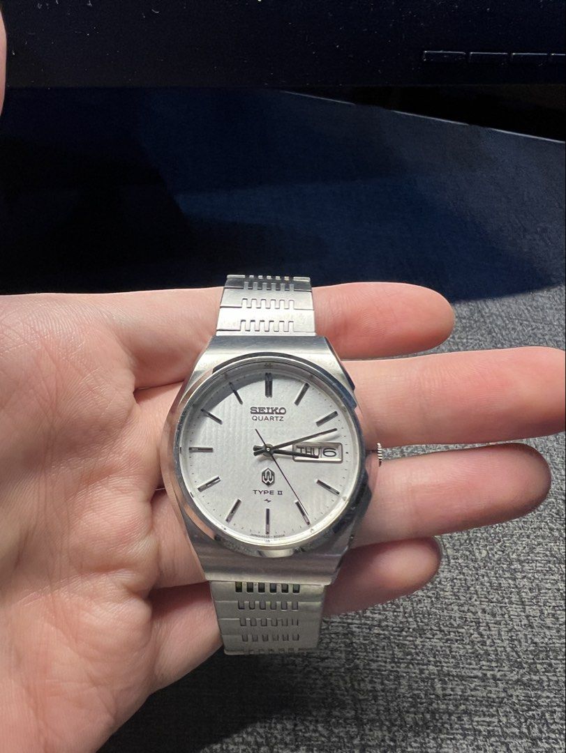 Seiko Quartz Type II Day Date Watch (Category: Men's Watches) located in Manila. Submitted by rvss99 (Listing ID 1454069876, Image 1). Description: - Vintage Seiko Quartz Type II Watch - Classic Silver Dial - Day and Date Complication Japanese & English - Durable Stainless Steel Case - Stainless Steel Bracelet (Note: Has visible scratches) - Watch is in running condition - Excellent addition for watch collectors - Minor hairline marks on the crys