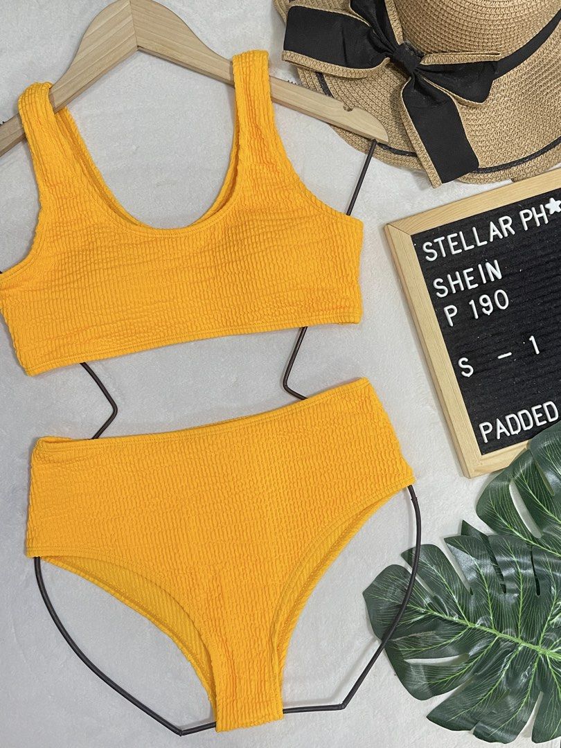 Shein Yellow Orange Textured Bikini Set Padded Size S (Category: Bikinis & Swimsuits) located in Manila. Submitted by camillestc (Listing ID 1454043385, Image 1). Description: - Orange textured bikini set from Shein - High-waisted bottoms - Scoop neck top with padded cups - BEST FIT MEDIUM - Ideal for beach days and pool parties - Sold as a complete set.