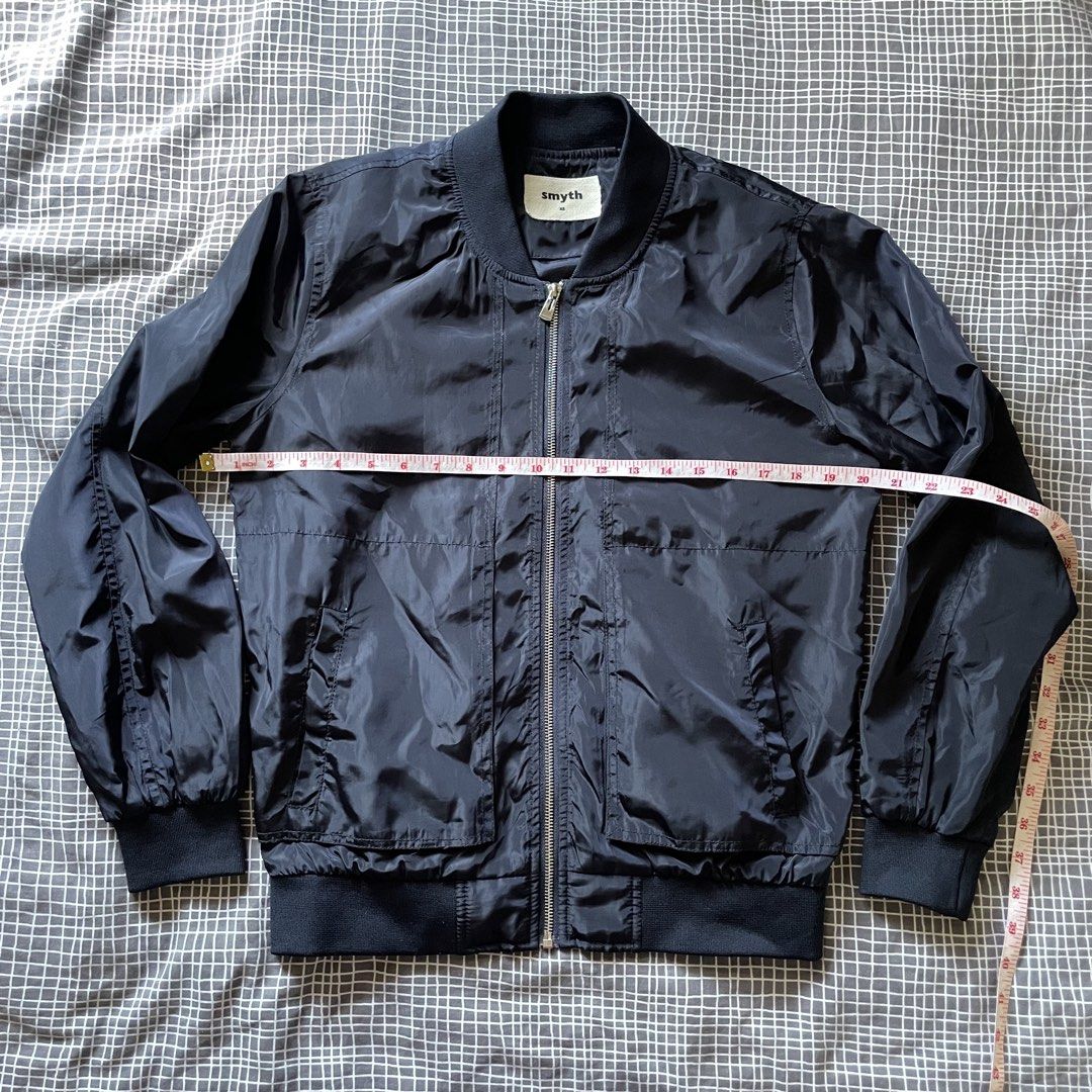 Smyth Bomber Jacket XS- M Navy Blue (Category: Coats, Jackets and Outerwear) located in Mandaluyong City. Submitted by elmo_7 (Listing ID 1454036946, Image 2). Description: - Navy blue Smyth bomber jacket - Size XS but could fit to M - Zip-up front closure - Elasticated cuffs and hem - Two front pockets - Lightweight material - Ideal for layering.