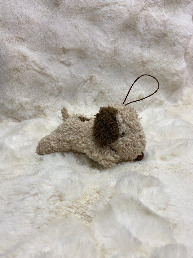 Snoopy Plush Toy Keychain Dog (Category: Plushies & Soft Toys) located in Kalibo. Submitted by ollie_stuffshop (Listing ID 1454101003, Image 1). Description: Before you send your inquiries: ❗️Last Price is already posted ❗️Manage your expectations, WYSIWYG ❗️May need washing ❗️Shipping day is every Sunday - Adorable Snoopy plush toy - Features a convenient hanging loop - Ideal for attaching to bags or keys - Color: Brown and cream - Compact and p