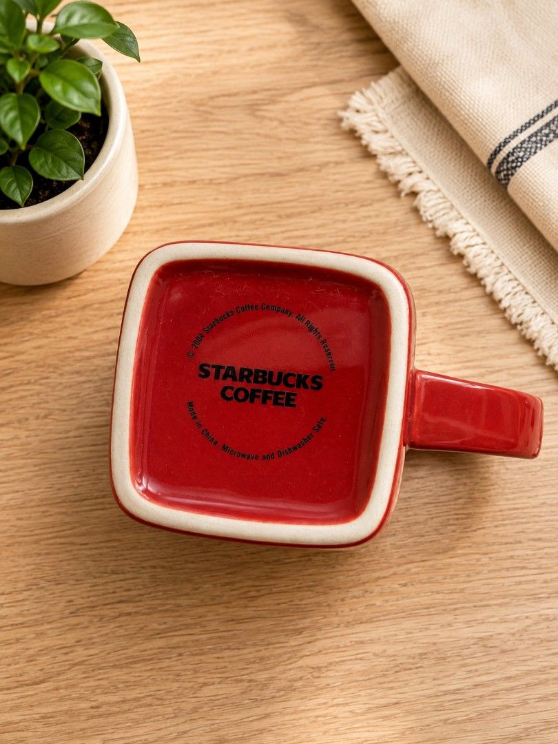 Starbucks Red Coffee Mug Square Design (Category: Coffee & Tea Tableware) located in Magdalena. Submitted by ckvf032922 (Listing ID 1454116512, Image 2). Description: - Red Starbucks coffee mug - Unique square shape - Cool snowflake-like design on the front - Starbucks Coffee logo on the bottom - Microwave and dishwasher safe - Ideal for your morning coffee or tea.