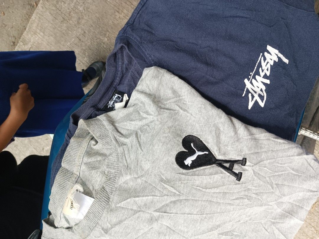 Stussy and Puma x Ami T-shirts Bundle (Category: Tshirts & Polo Shirts ) located in Midsayap. Submitted by princeandy19441 (Listing ID 1454088953, Image 1). Description: - Bundle deal: Stussy navy blue graphic tee + Puma x Ami grey graphic tee - Stussy tee features classic Stussy logo - Puma x Ami tee has a unique heart and cat logo - Both are great for casual, everyday wear.