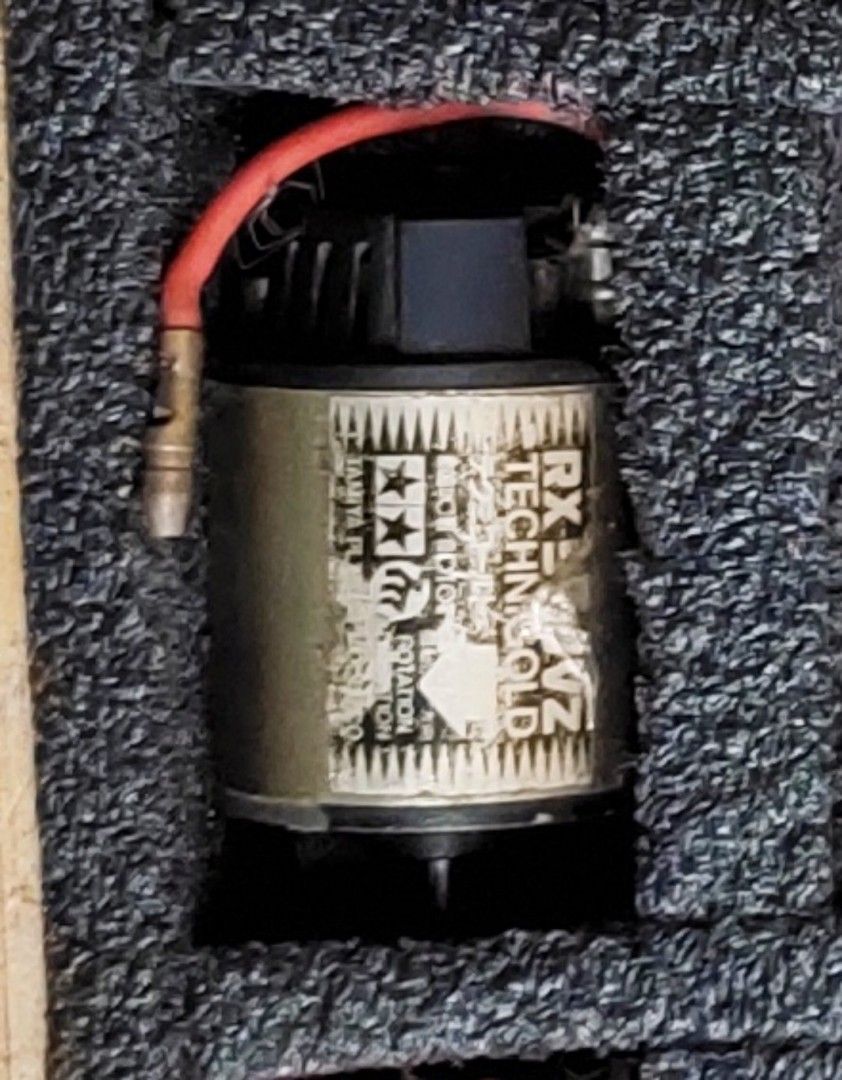 Tamiya RX-540 Technigold RC Car Motor (Category: Remote Control Toys) located in Caloocan City. Submitted by mjraymundo48160 (Listing ID 1454036222, Image 1). Description: - Tamiya RX-540 Technigold motor - Classic brushed motor for RC cars - Features attached red wire - Label shows some wear but remains readable - Ideal for vintage RC builds and replacements - Feel free to ask questions!.