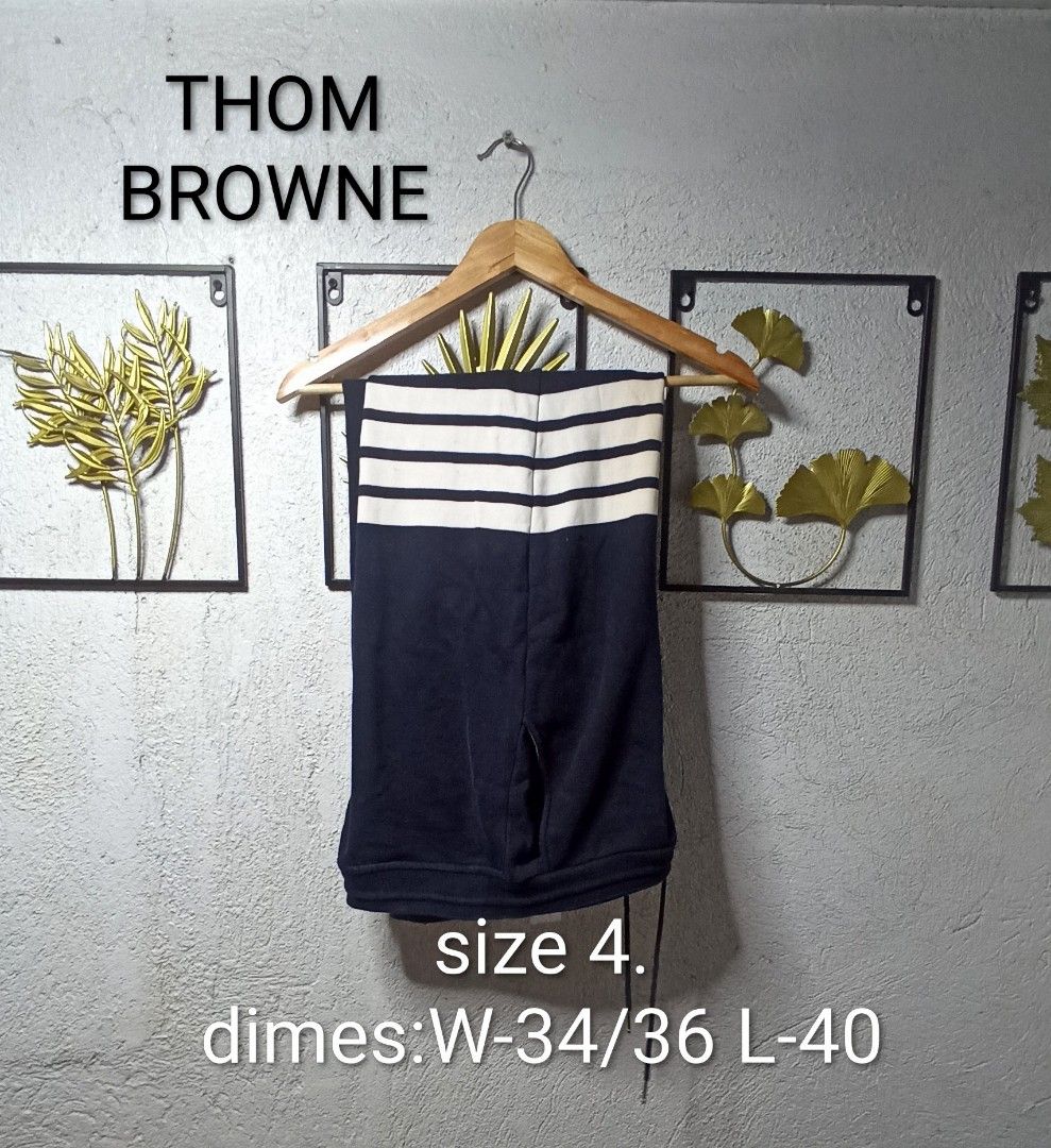 Thom Browne Navy Sweatpants Size 4 (Category: Joggers) located in Kawit. Submitted by deidzdzn (Listing ID 1454114507, Image 1). Description: - Authentic Thom Browne Navy Sweatpants - Size: 4 - Signature white stripes on the side - Elastic waistband with drawstring - Made in Japan - Measurements: Waist 34/36, Length 40.