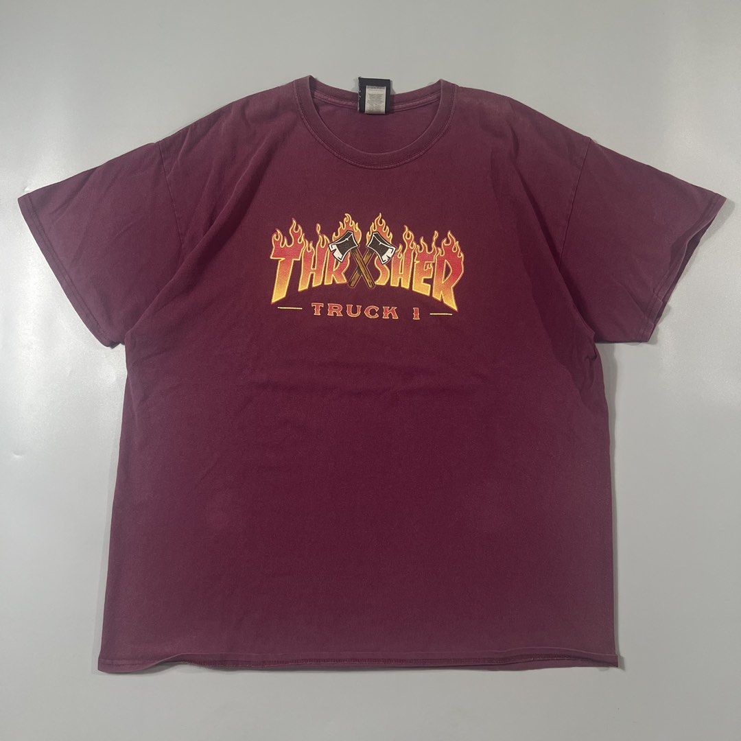 Thrasher Flame Tee (Category: Tshirts & Polo Shirts ) located in Baguio. Submitted by pinkpixie (Listing ID 1454153615, Image 1). Description: - Burgundy Thrasher t-shirt - Classic flame logo with "Truck 1" text - Size: XL (check tag) - Material: 100% Cotton - Ideal for skater and streetwear enthusiasts.