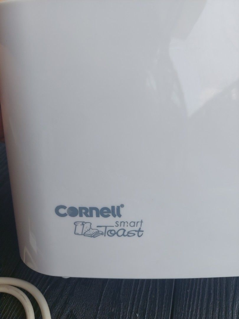 Bread Toaster (Category: Ovens & Toasters) located in Singapore. Submitted by precious_thought (Listing ID 1454043001, Image 3). Description: - Cornell Smart Toast toaster - White color - Simple and compact - Adjustable browning control - Easy-to-use lever - Good working condition.