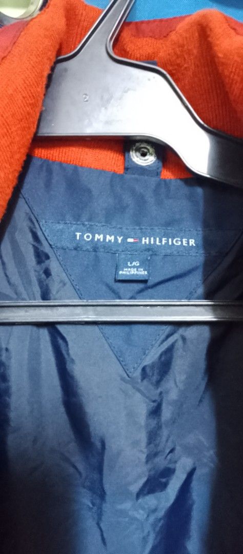 Tommy Hilfiger Colorblock Jacket Navy Red Size L (Category: Coats, Jackets and Outerwear) located in Manila. Submitted by bunshoy09 (Listing ID 1454073330, Image 3). Description: - Tommy Hilfiger Jacket - Color: Navy and Red - Size: Large (L) - Features: Zipper closure, zippered pockets - Collar Detail: 'HILFIGER' print - Lining: Navy - Origin: Made in the Philippines - Condition: Please check photos for details issue: may dlwang zipper na na sto