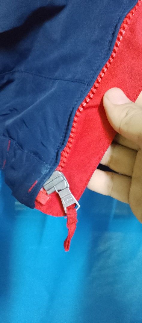 Tommy Hilfiger Colorblock Jacket Navy Red Size L (Category: Coats, Jackets and Outerwear) located in Manila. Submitted by bunshoy09 (Listing ID 1454073330, Image 2). Description: - Tommy Hilfiger Jacket - Color: Navy and Red - Size: Large (L) - Features: Zipper closure, zippered pockets - Collar Detail: 'HILFIGER' print - Lining: Navy - Origin: Made in the Philippines - Condition: Please check photos for details issue: may dlwang zipper na na sto