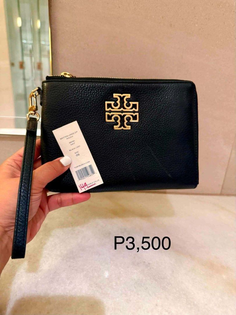 Tory Burch Britten Large Zip Pouch Black (Category: Luxury Bags & Wallets) located in Manila. Submitted by dressesaroundmetro (Listing ID 1454105259, Image 1). Description: - Tory Burch Britten Large Zip Pouch - Color: Black Preloved - Material: Pebbled Leather - Hardware: Gold - Includes: Detachable wrist strap - Size: Large - Perfect for carrying your daily essentials.