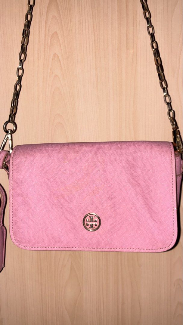 Tory Burch Pink Leather Shoulder Bag with Chain Strap (Category: Luxury Bags & Wallets) located in Placer. Submitted by talaalond61563 (Listing ID 1454049326, Image 2). Description: - Tory Burch Robinson crossbody - Genuine leather with gold hardware - Stylish chain strap and tassel detail - Interior: 1 zip pocket, 1 slip pocket - Interior is clean - Versatile for everyday or evening wear.