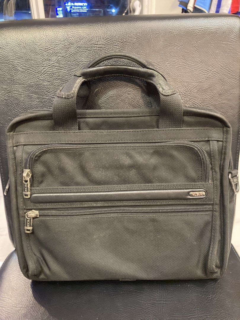 Tumi Alpha Black Nylon Briefcase Laptop Bag (Category: Briefcases) located in Quezon City. Submitted by janisu0303 (Listing ID 1454180264, Image 3). Description: - Tumi Alpha Messenger Bag - well used - 5500 php - fairview area meetups Or shipping - Made from high-quality nylon - Multiple zippered compartments for excellent organization - Comfortable padded handles - Includes a detachable shoulder strap for versatile carrying - Perfect for both w