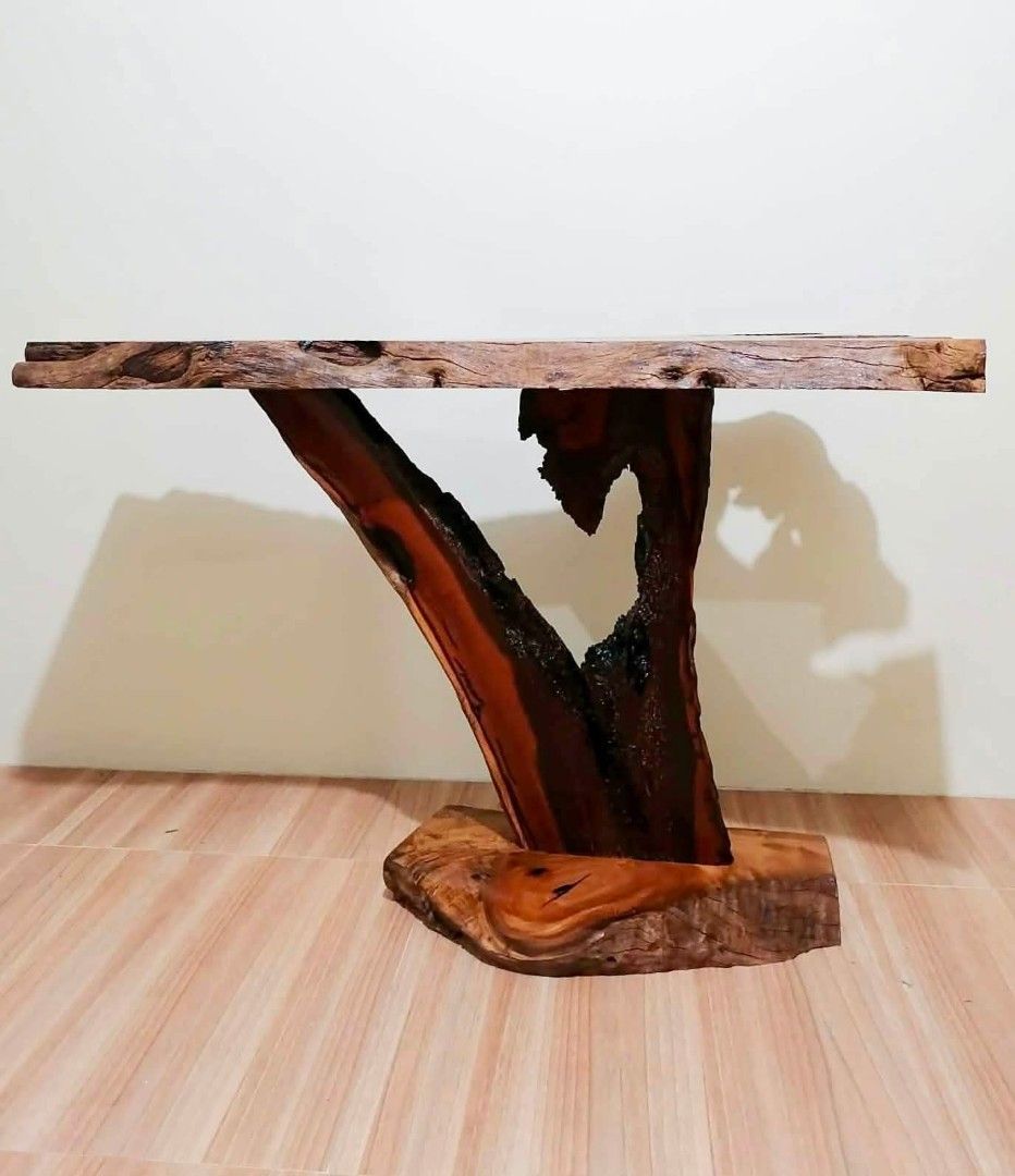 Unique Live Edge Wood Console Table with Natural Wood Base (Category: Tables & Sets) located in Manila. Submitted by youngflower_9e0e16 (Listing ID 1454152151, Image 1). Description: - One-of-a-kind console table - Features a live edge wood slab top - Base crafted from a natural wood trunk and solid wood piece - Beautiful, rich wood grain - Rustic and organic aesthetic - Ideal statement piece for entryway or living room - Approximate dimensions: 