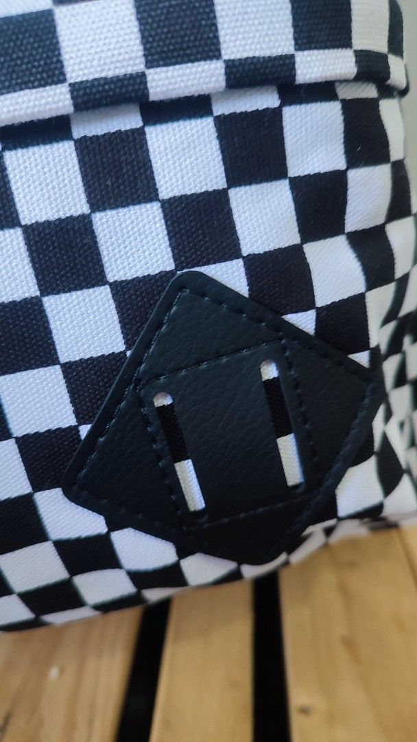 Vans Checkerboard Backpack (Category: Backpacks) located in Manila. Submitted by janyvony_315 (Listing ID 1454009511, Image 3). Description: - Classic Vans checkerboard design (black & white) - Front zip pocket for essentials - Spacious main compartment - Adjustable shoulder straps for comfort - Brand new with tags still attached - Ideal for school, work, or everyday use.