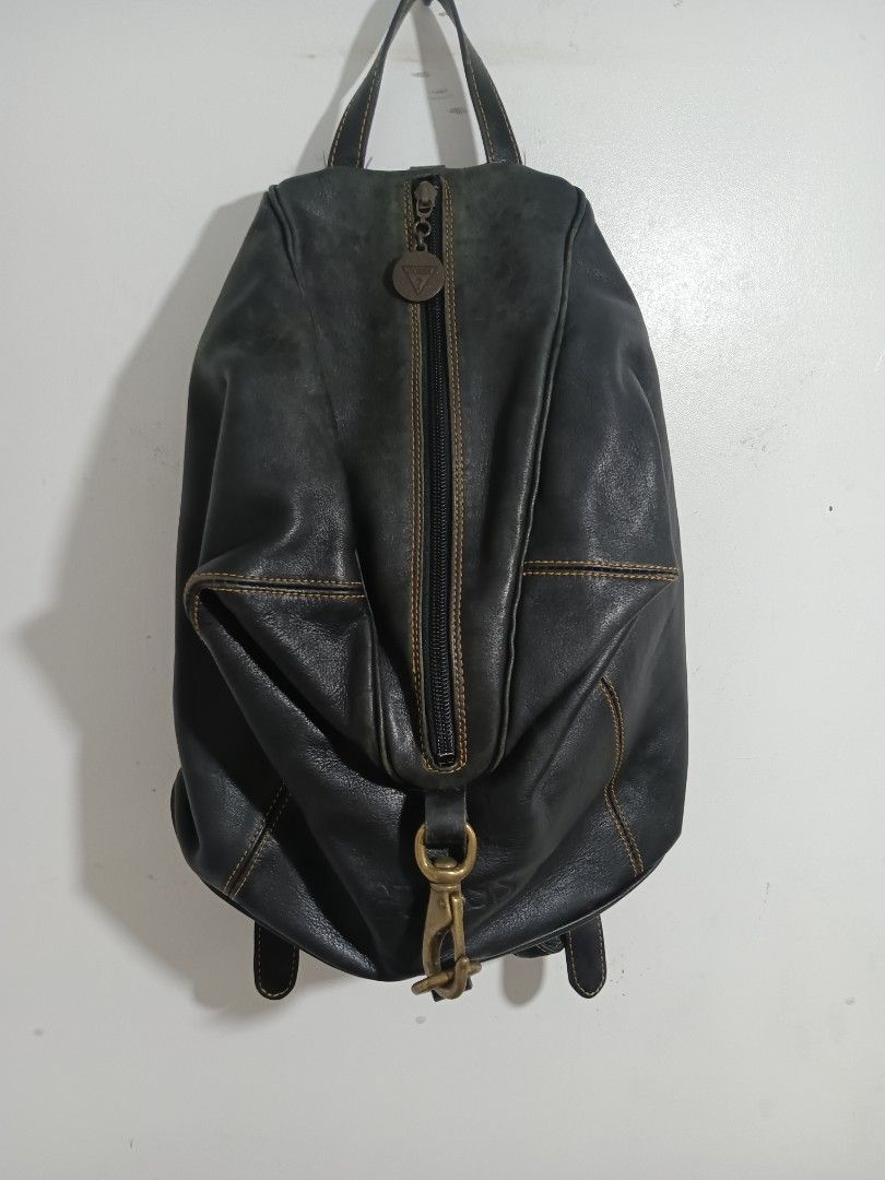 Vintage 80s GUESS leather Backpack (Category: Luxury Bags & Wallets) located in General Santos City (Dadiangas). Submitted by silvervintage77 (Listing ID 1454084639, Image 1). Description: Vintage 80s GUESS leather Backpack Rare 80s GUESS leather Backpack Excellent condition 9.5/10 color rate Size 11 Width X 16 length.