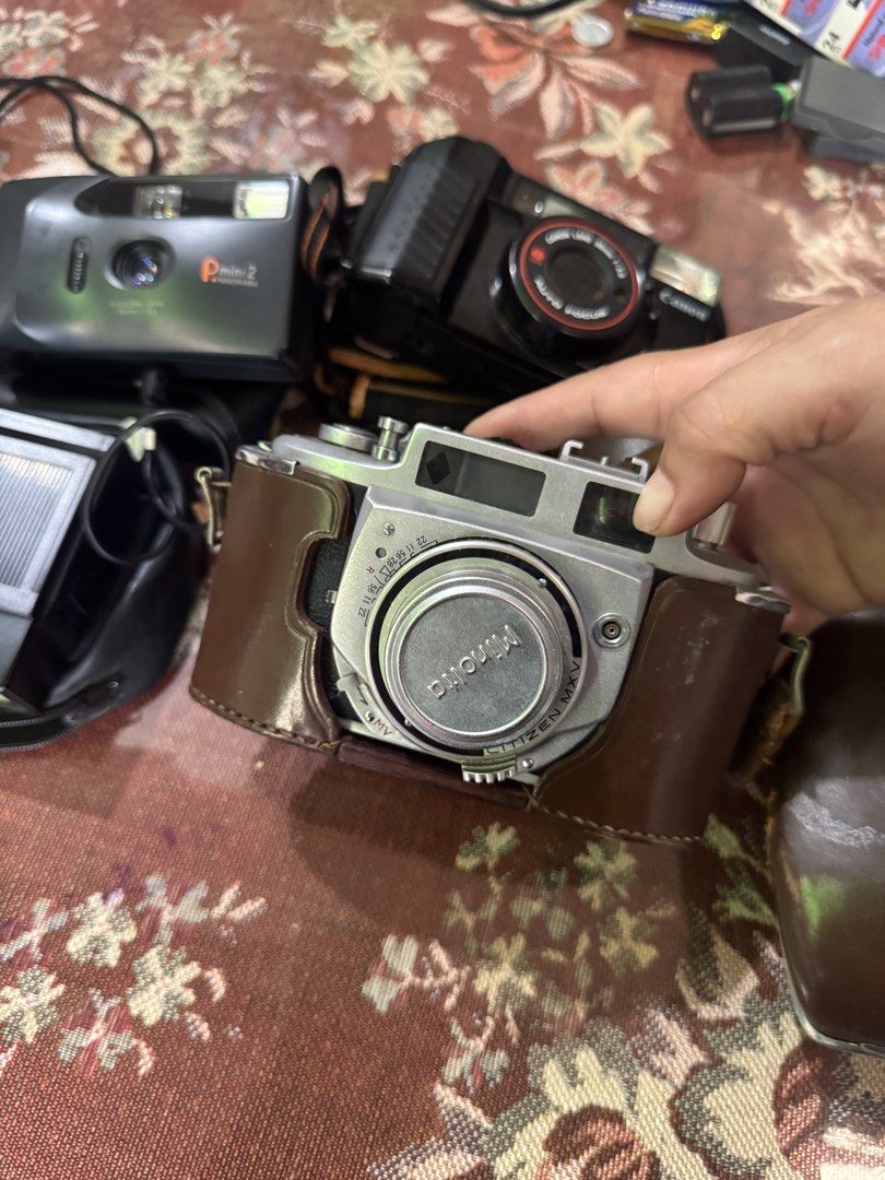 Vintage Camera Bundle: Minolta, Canon, Pmini 2, National Flash (Category: Cameras) located in Cainta. Submitted by danica010314 (Listing ID 1454085924, Image 2). Description: UNTESTED PO LAHAT KAYO NA PO MAG PAGAWA - Bundle includes: Minolta A.2, Canon Auto Focus, Pmini 2 Panorama cameras - Also includes: National 2801 flash unit - Some items come with original leather cases - Ideal for vintage camera collectors - Perfect for film photography ent