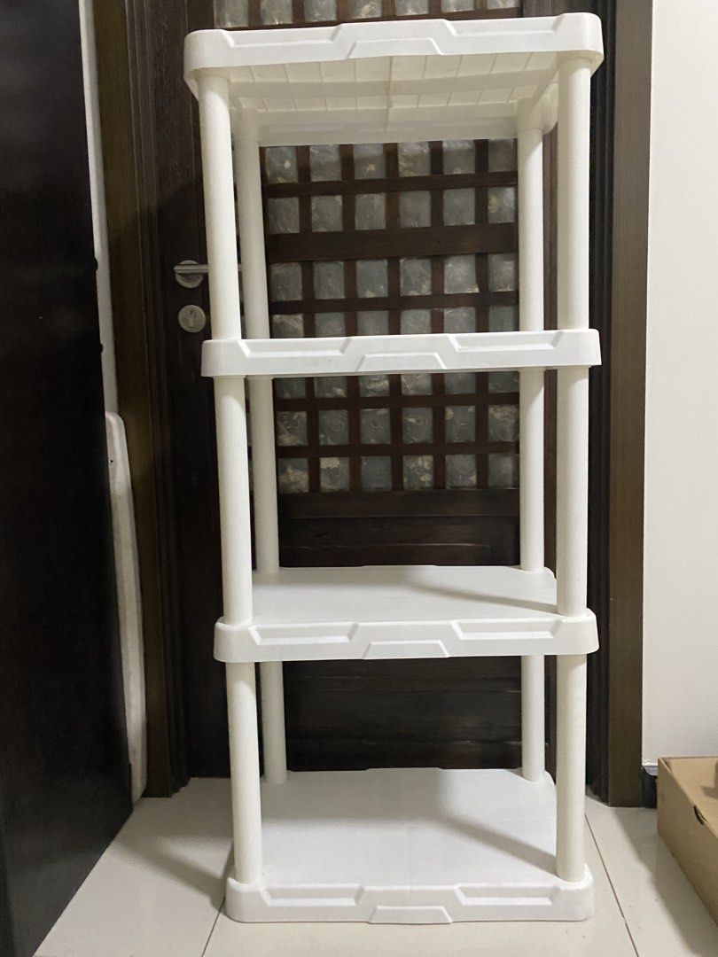 White 4-Tier Plastic Storage Shelf Rack (Category: Shelves, Cabinets & Racks) located in Quezon City. Submitted by waytodeclutter (Listing ID 1454166807, Image 1). Description: - 4-tier white plastic storage shelf - Ideal for organizing items in any room - Easy to assemble and move - Sturdy construction - Suitable for home or office use inches- 21.5 x 13.5 x50.