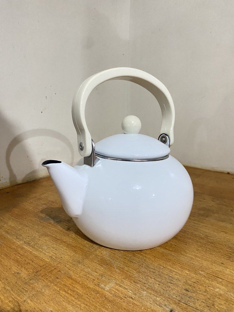 White Enamel Stovetop Teapot (Category: Cookware & Accessories) located in Bulacan. Submitted by waterbearer_ (Listing ID 1454177708, Image 2). Description: ✔️ Good condition ✔️ Durable enamel-coated metal ✔️ Perfect for boiling water for tea or coffee ✔️ Classic, minimalist design ✔️ Ideal for everyday use or kitchen display.