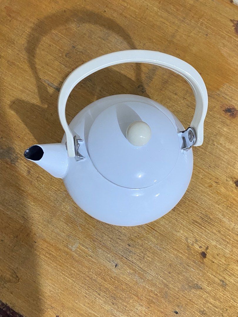 White Enamel Stovetop Teapot (Category: Cookware & Accessories) located in Bulacan. Submitted by waterbearer_ (Listing ID 1454177708, Image 3). Description: ✔️ Good condition ✔️ Durable enamel-coated metal ✔️ Perfect for boiling water for tea or coffee ✔️ Classic, minimalist design ✔️ Ideal for everyday use or kitchen display.
