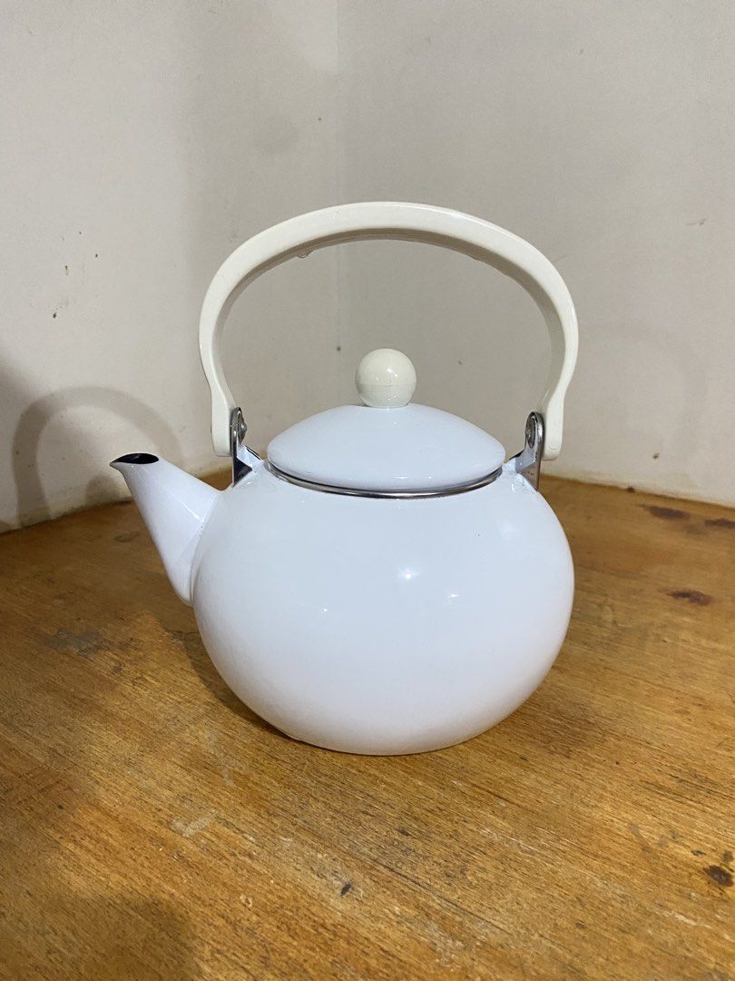 White Enamel Stovetop Teapot (Category: Cookware & Accessories) located in Bulacan. Submitted by waterbearer_ (Listing ID 1454177708, Image 1). Description: ✔️ Good condition ✔️ Durable enamel-coated metal ✔️ Perfect for boiling water for tea or coffee ✔️ Classic, minimalist design ✔️ Ideal for everyday use or kitchen display.