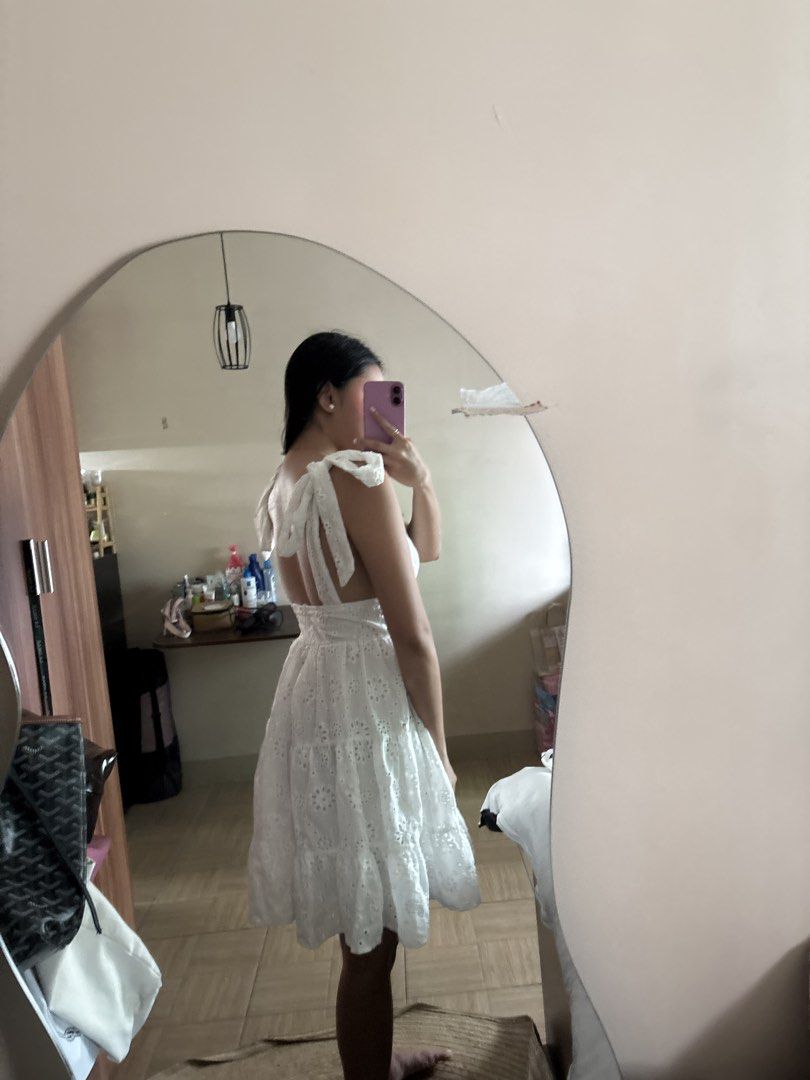 White Eyelet Tie Strap Mini Dress (Category: Dresses) located in Manila. Submitted by _foryou (Listing ID 1454035301, Image 3). Description: - Cute white eyelet mini dress - Plunging neckline with tie shoulder straps - Tiered skirt with eyelet details - Ideal for summer or beach vacations - Lightweight and flowy fabric - Easy to style for any occasion.
