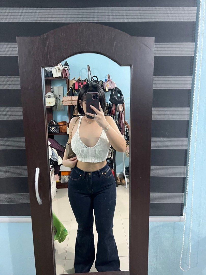White Knit V-Neck Cropped Tank Top (Category: Sleeveless) located in Manila. Submitted by pmuffy24 (Listing ID 1454169935, Image 2). Description: - White knit tank top - V-neckline with thick straps - Ribbed texture all over - Cropped length - Versatile: pairs well with high-waisted jeans or skirts.