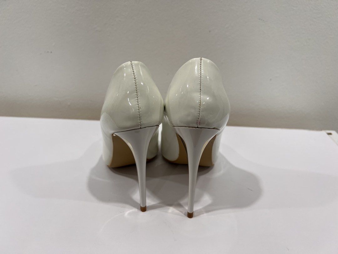 White stiletto heels (Category: Heels) located in Manila. Submitted by threadtressure (Listing ID 1454103593, Image 2). Description: So Fab! white stiletto heels with gold detailing. Size 35. Glue residue on the sides Condition: 8/10 Issues: Glue residue on the sides.