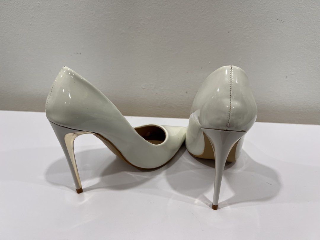 White stiletto heels (Category: Heels) located in Manila. Submitted by threadtressure (Listing ID 1454103593, Image 3). Description: So Fab! white stiletto heels with gold detailing. Size 35. Glue residue on the sides Condition: 8/10 Issues: Glue residue on the sides.