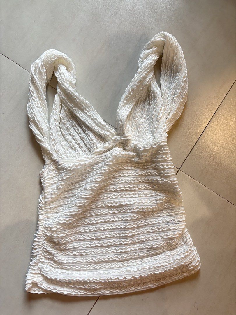 White Textured Ruched V-Neck Tank Top Size M (Category: Sleeveless) located in Manila. Submitted by sush1bae (Listing ID 1454049316, Image 2). Description: actual when worn top on pic - SHEIN white textured tank top - Features all-over ruching on the body and straps - Flattering V-neckline - Made from a comfortable polyester and elastane blend - Versatile for casual outings or dressing up.